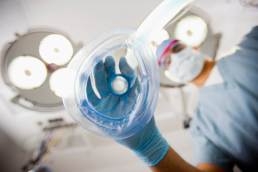 Anesthesiologist Holding Mask